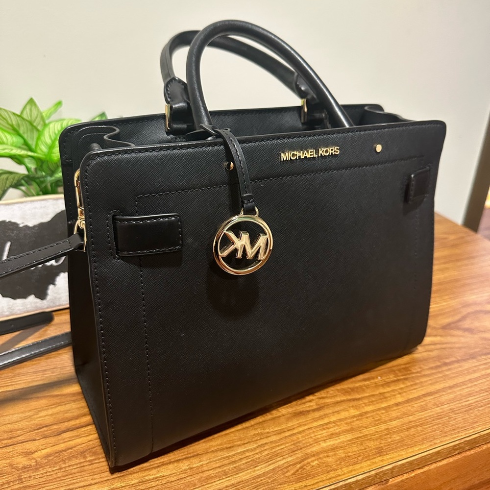Black Michael Kors handbag that can also be worn cross body.